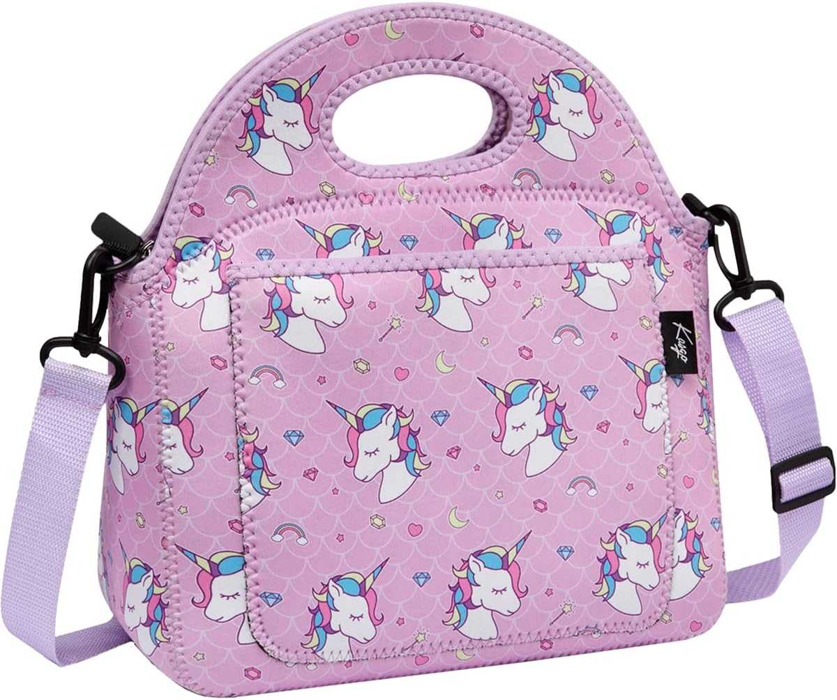 Pink unicorn lunch bag for kindergarten with lavender shoulder strap, handle cutout, front pocket, and playful rainbow and gem print.