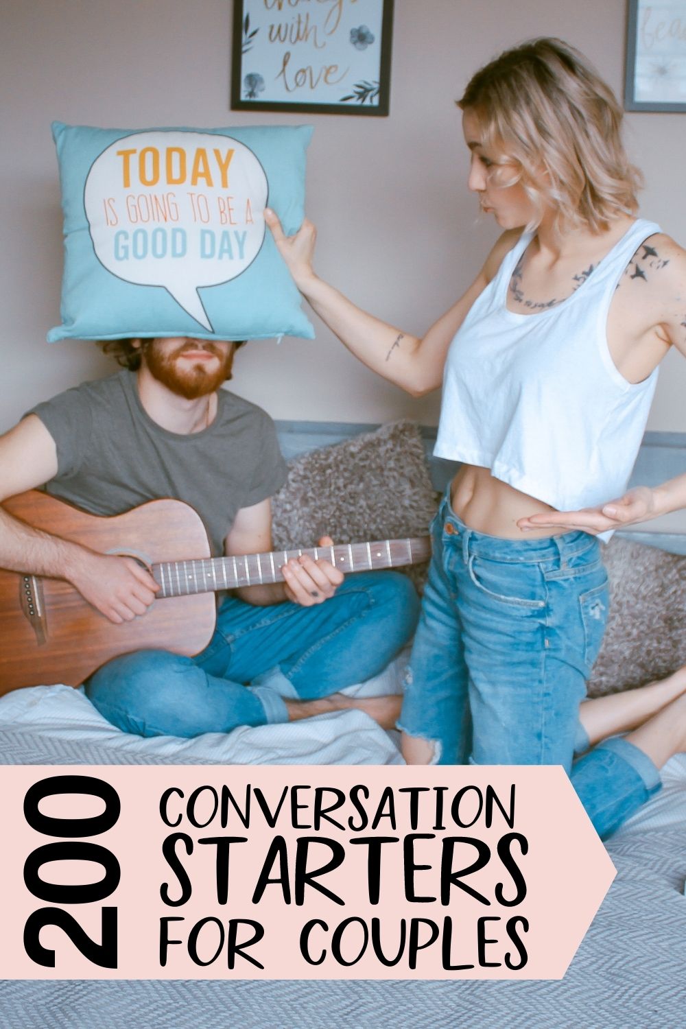 Couple on a bed with a guitar and pillow, overlaid with text reading 200 conversation starters for couples.