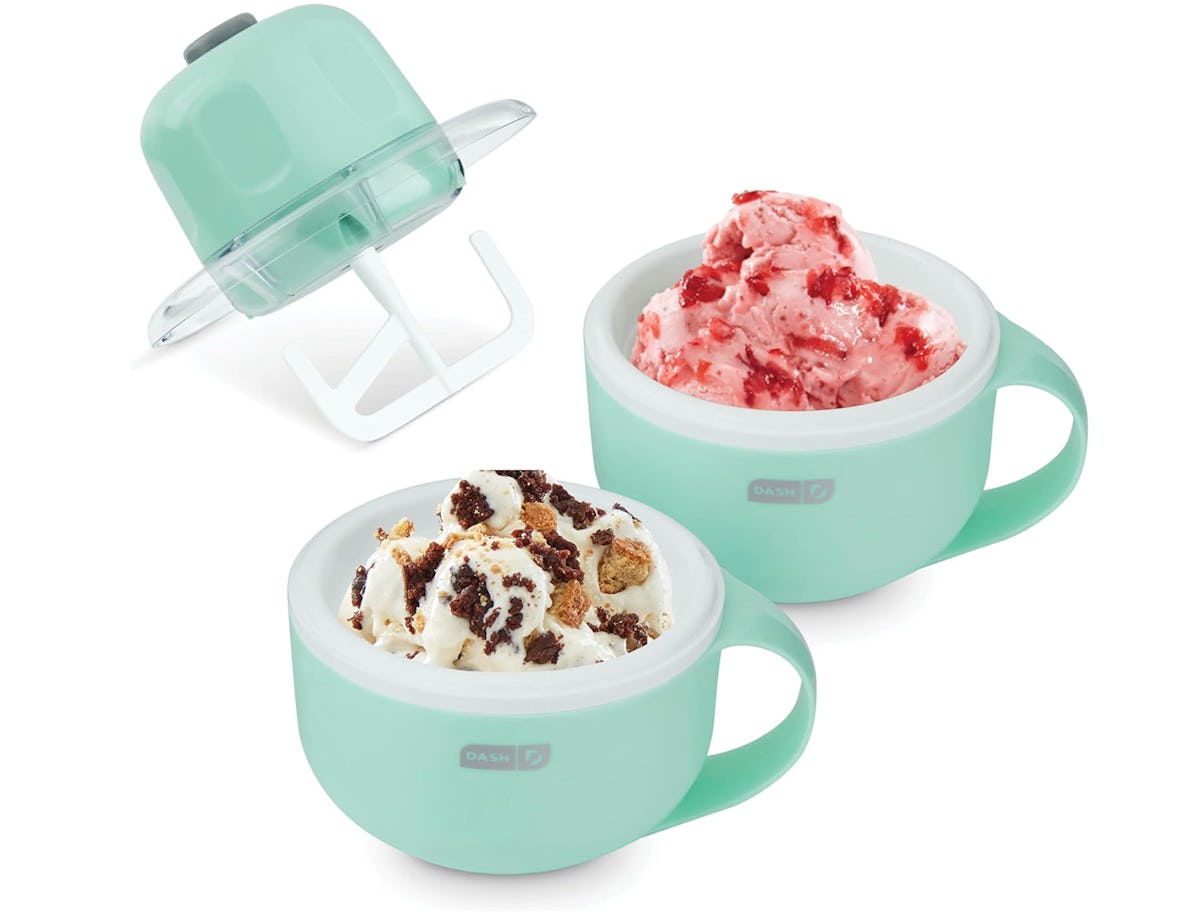 DASH My Mug ice cream maker set with mint green bowls, churn lid, and two servings of homemade ice cream on a white background.