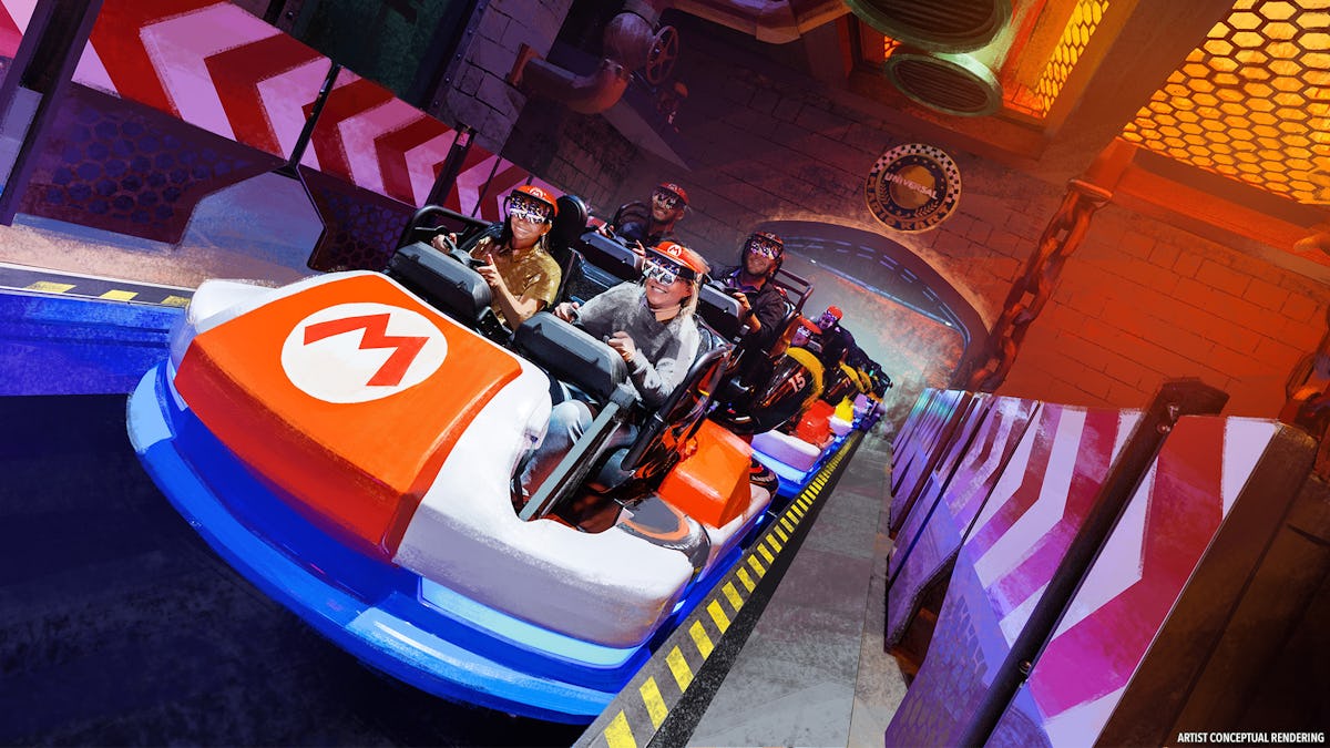 Guests ride a Mario Kart-themed attraction vehicle through a colorful Super Nintendo World set at Universal Epic Universe.