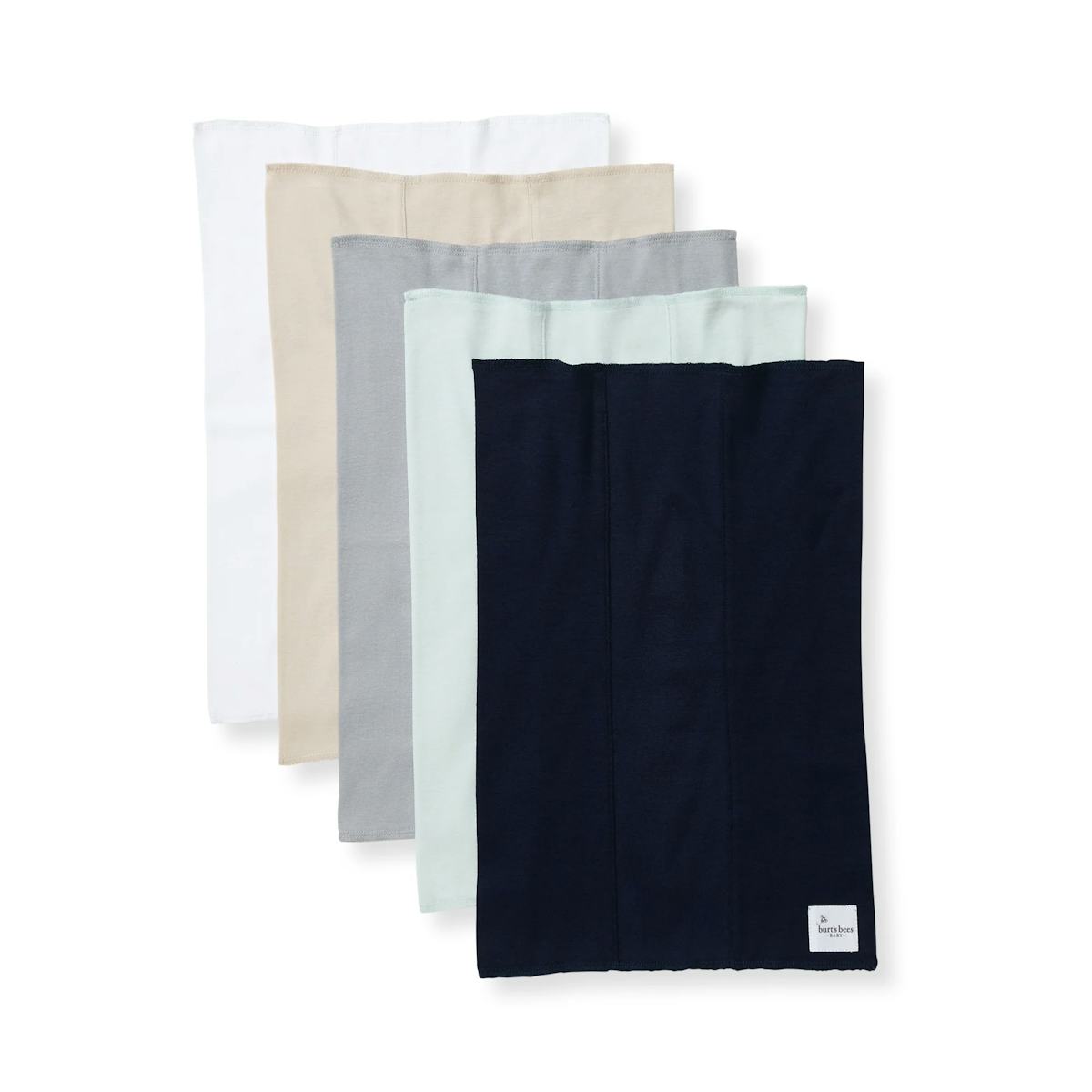 Five Burt's Bees Baby organic cotton burp cloths in white, beige, gray, mint, and navy stacked on a white background.