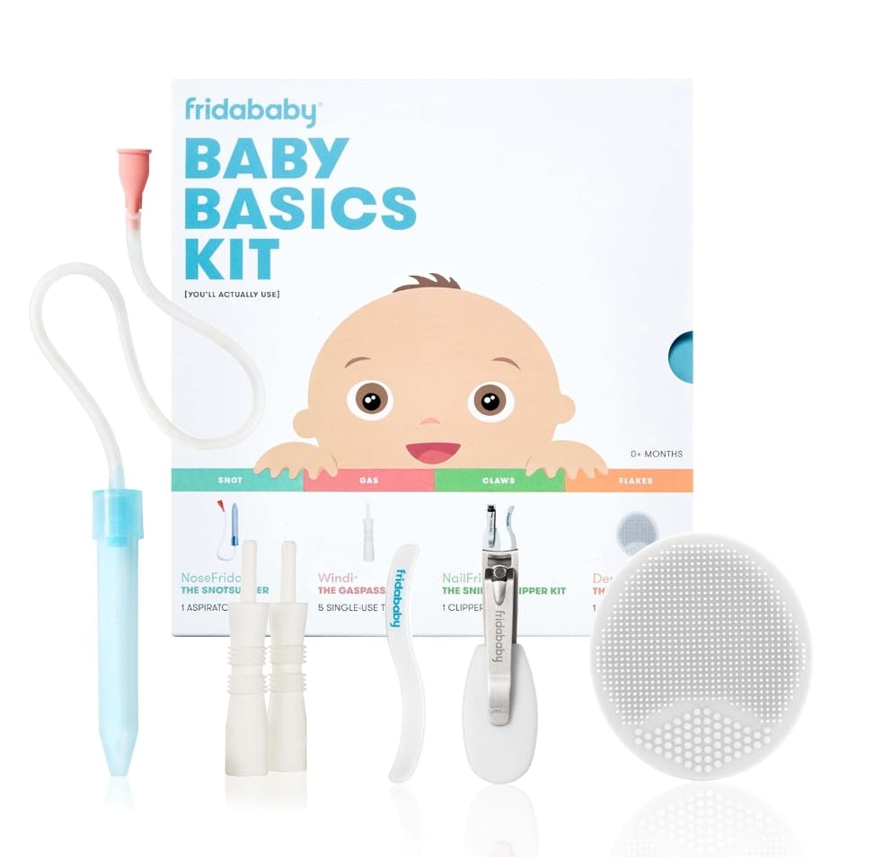 Fridababy Baby Basics Kit with NoseFrida aspirator, nail clipper, gaspasser tubes, silicone brush, and baby care tools on white background.