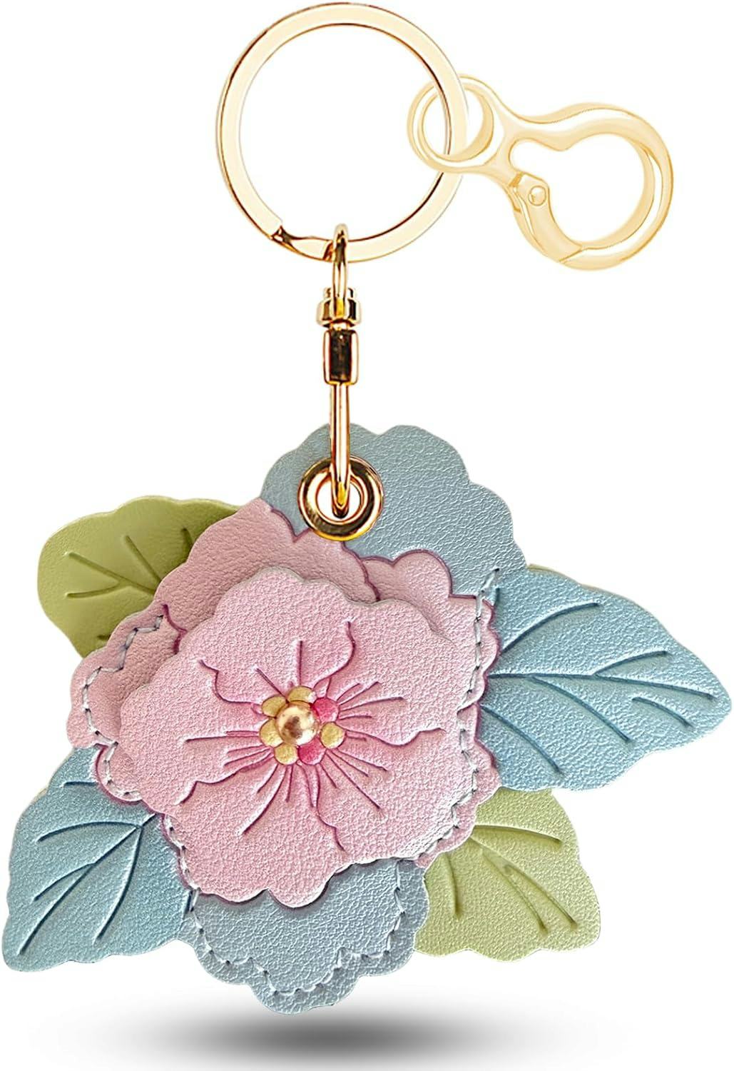 Pastel floral vegan leather keychain with pink flower, blue and green leaves, and gold ring and clasp on a white background.