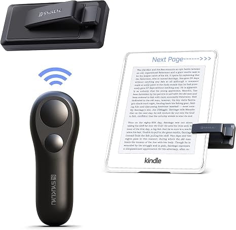 Black handheld remote and clip-on accessory beside a white Kindle e-reader with a blue wireless signal icon.