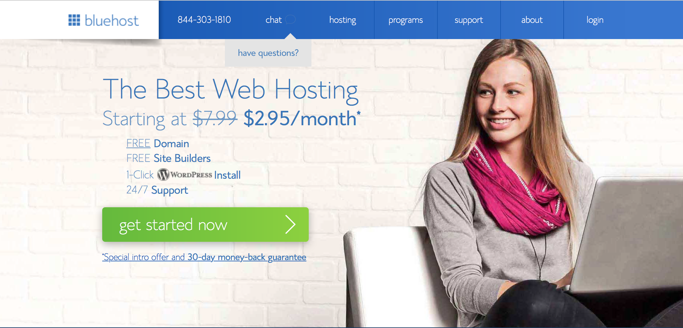 Bluehost web hosting page showing pricing text, navigation, and a woman using a laptop