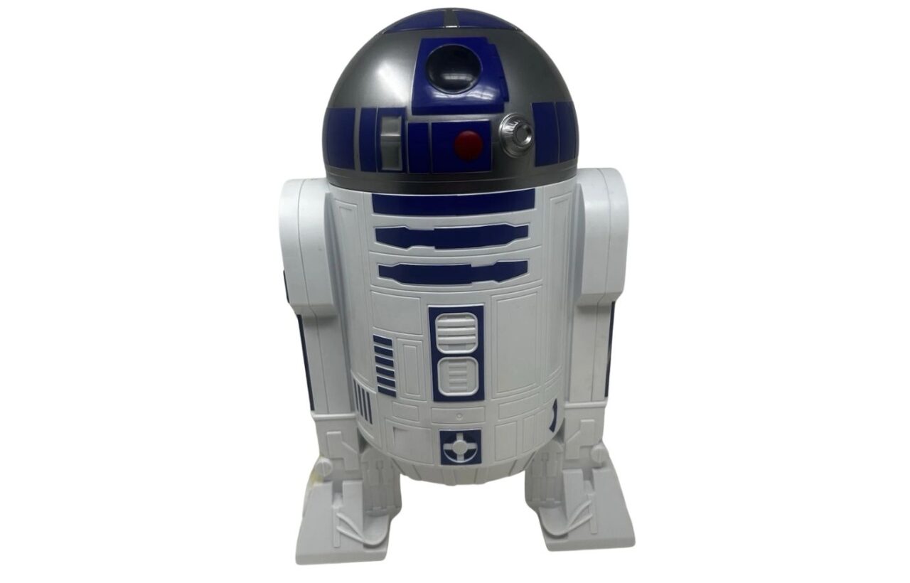 White and blue cylindrical robot-shaped container with a domed top on a plain white background.