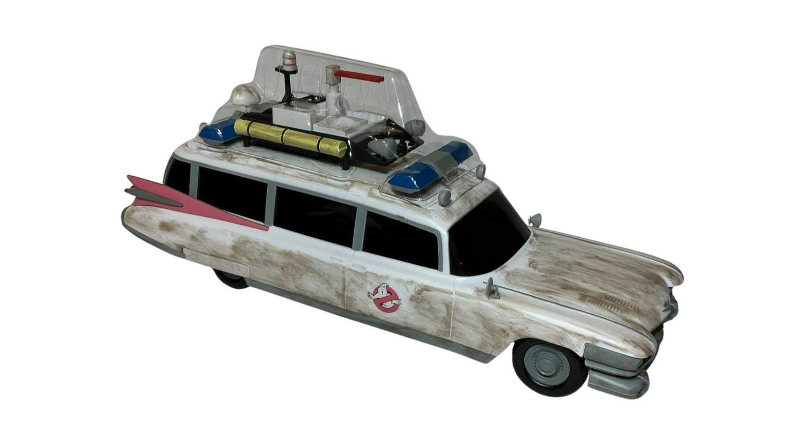 White toy car with roof accessories, blue lights, black windows, and a small ghost emblem on the side.