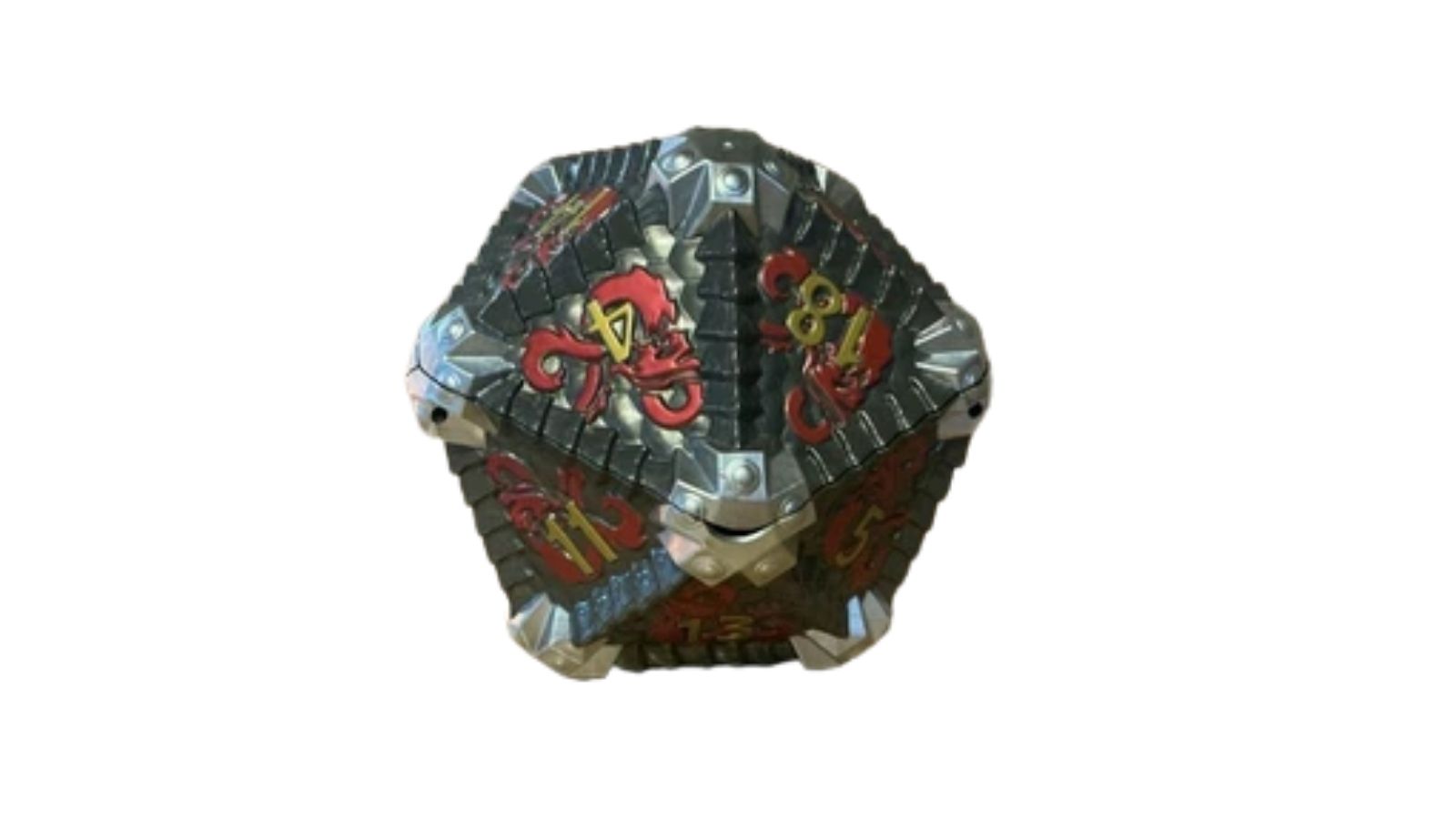 Dark, faceted dice-shaped container with red and yellow markings on a plain white background