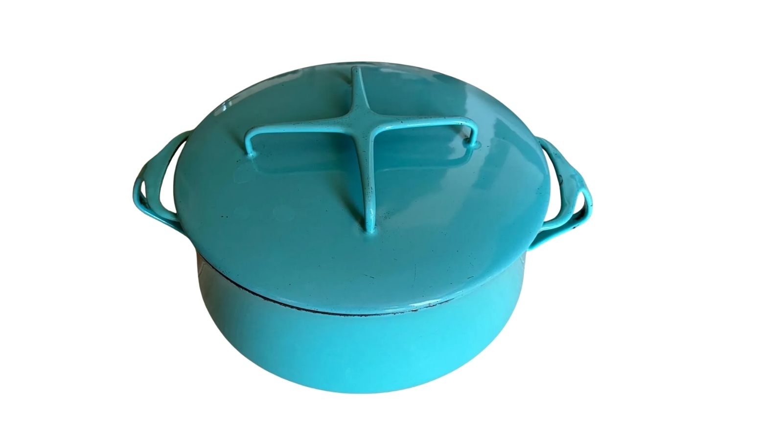 Turquoise lidded pot with side handles on a white background