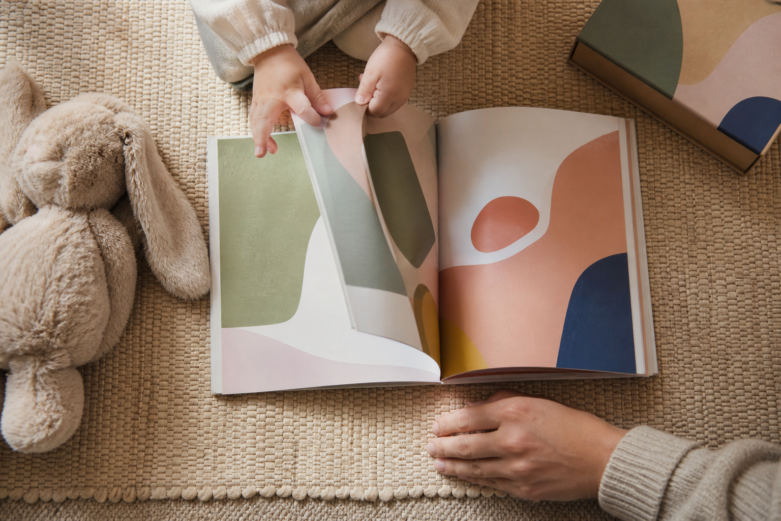 A toddler turns the page of one picture book while a closed collection remains nearby.